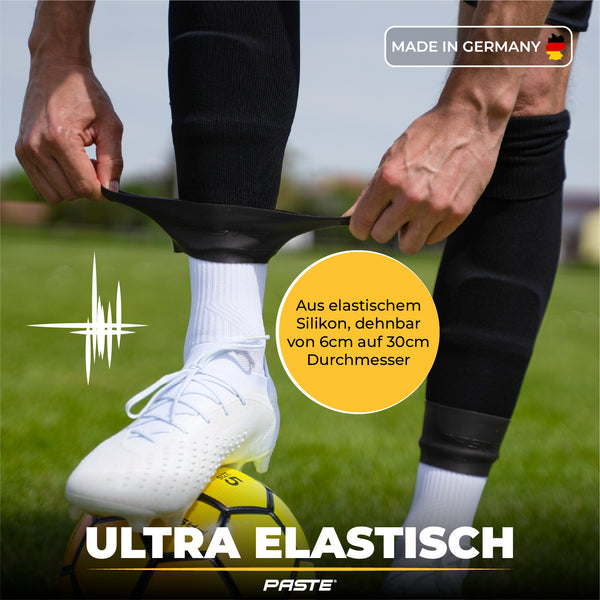 PASTE® Sujeta espinilleras de silicona de fútbol para hombres - Negro